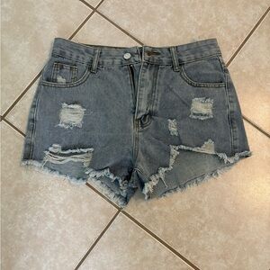 Denim cut-off shorts. Excellent condition. Never worn. Not meant for a big butt.